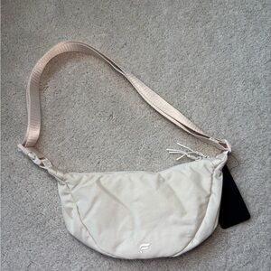 Fabletics “The Sling Bag” in Bone Crossbody Bag